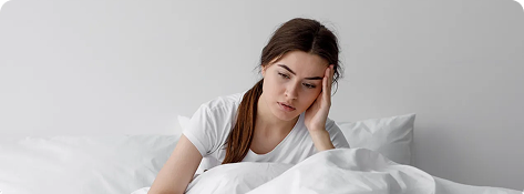 Tired woman resting bed